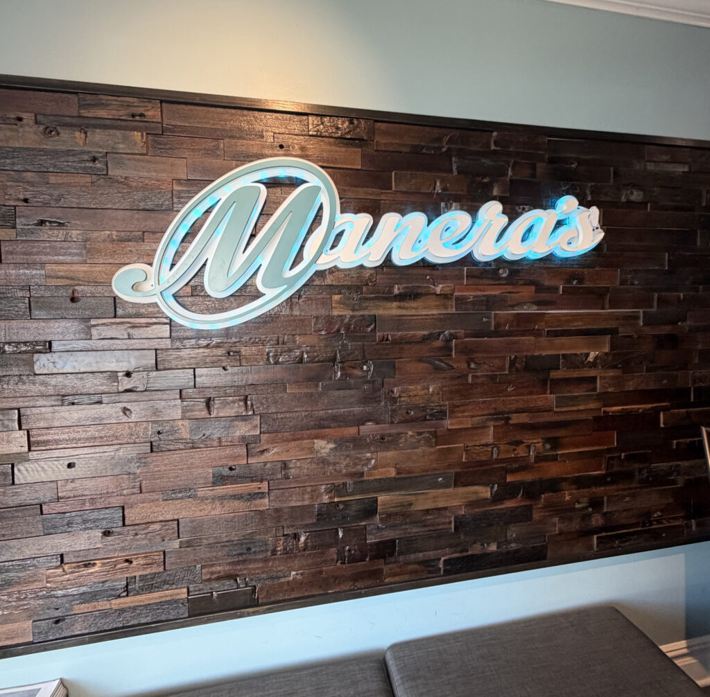 Illuminated dimensional interior logo sign installed at Manera's restaurant