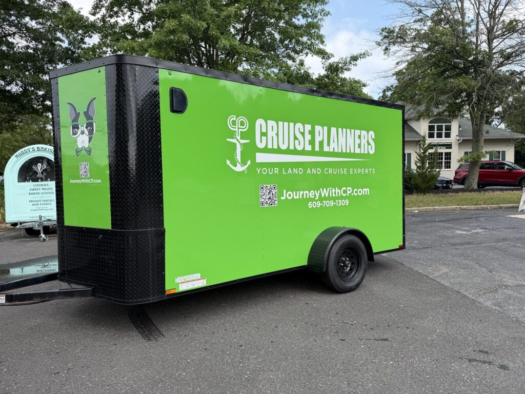 Cruise Planners green enclosed trailer branded graphics
